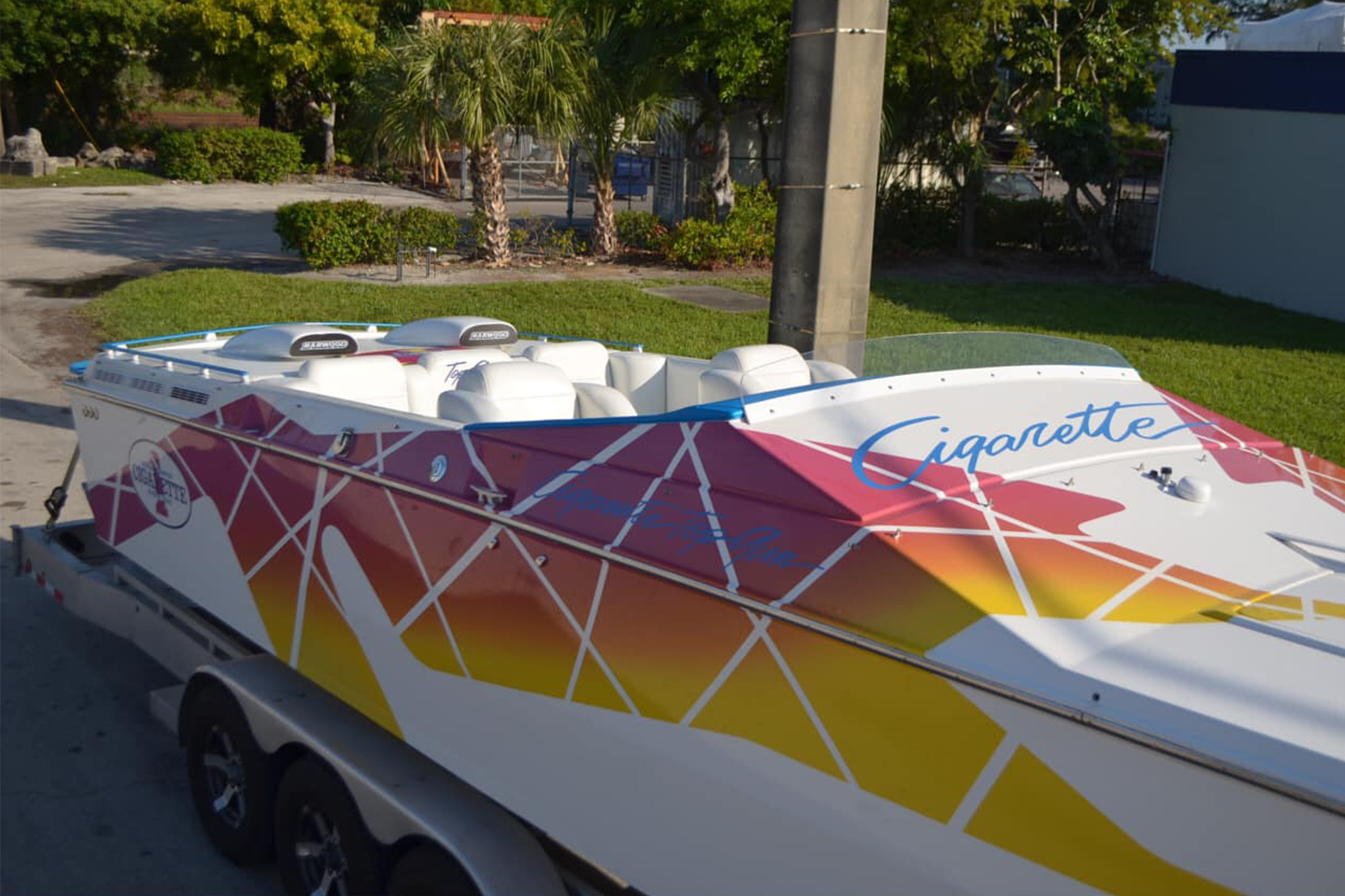 Custom cigarette boat on trailer.